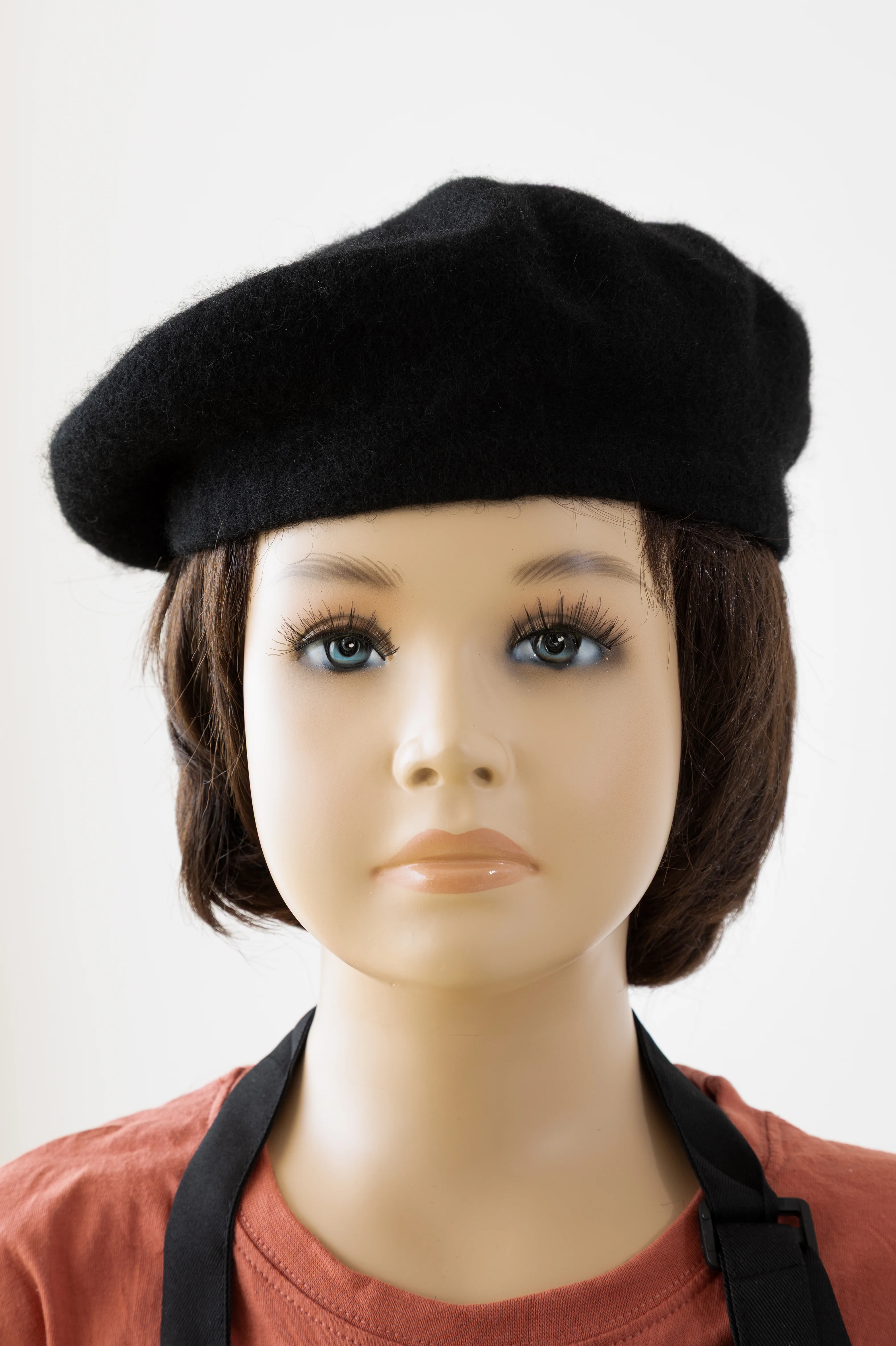 Close-up of a mannequin wearing a black beret in John Miller’s I Am an Artist at Magaluf